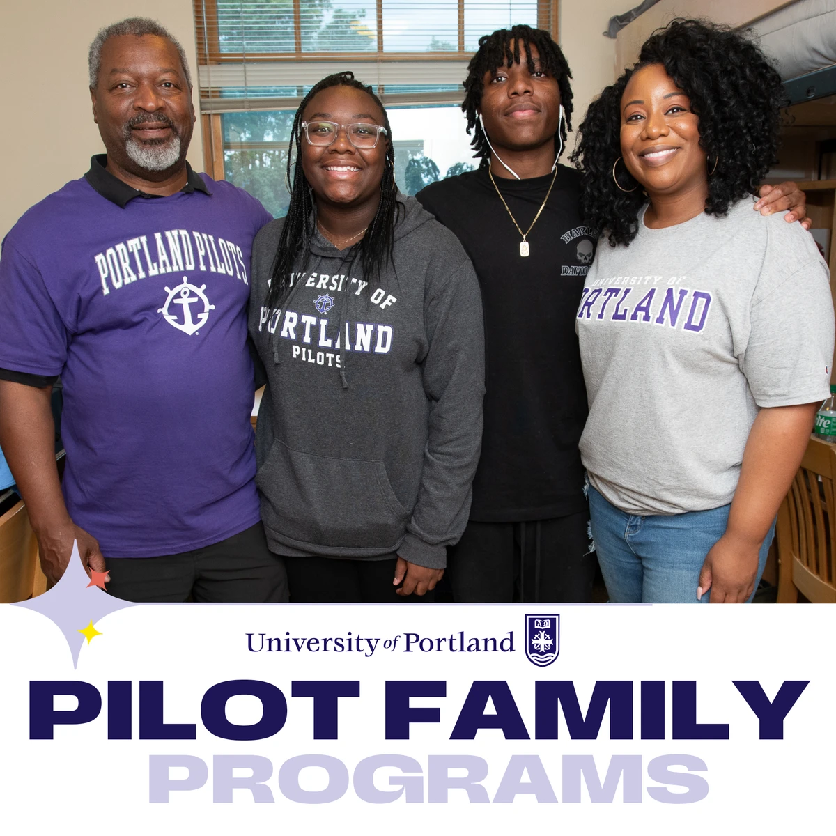 A family stands together in a room, all wearing apparel from the University of Portland.